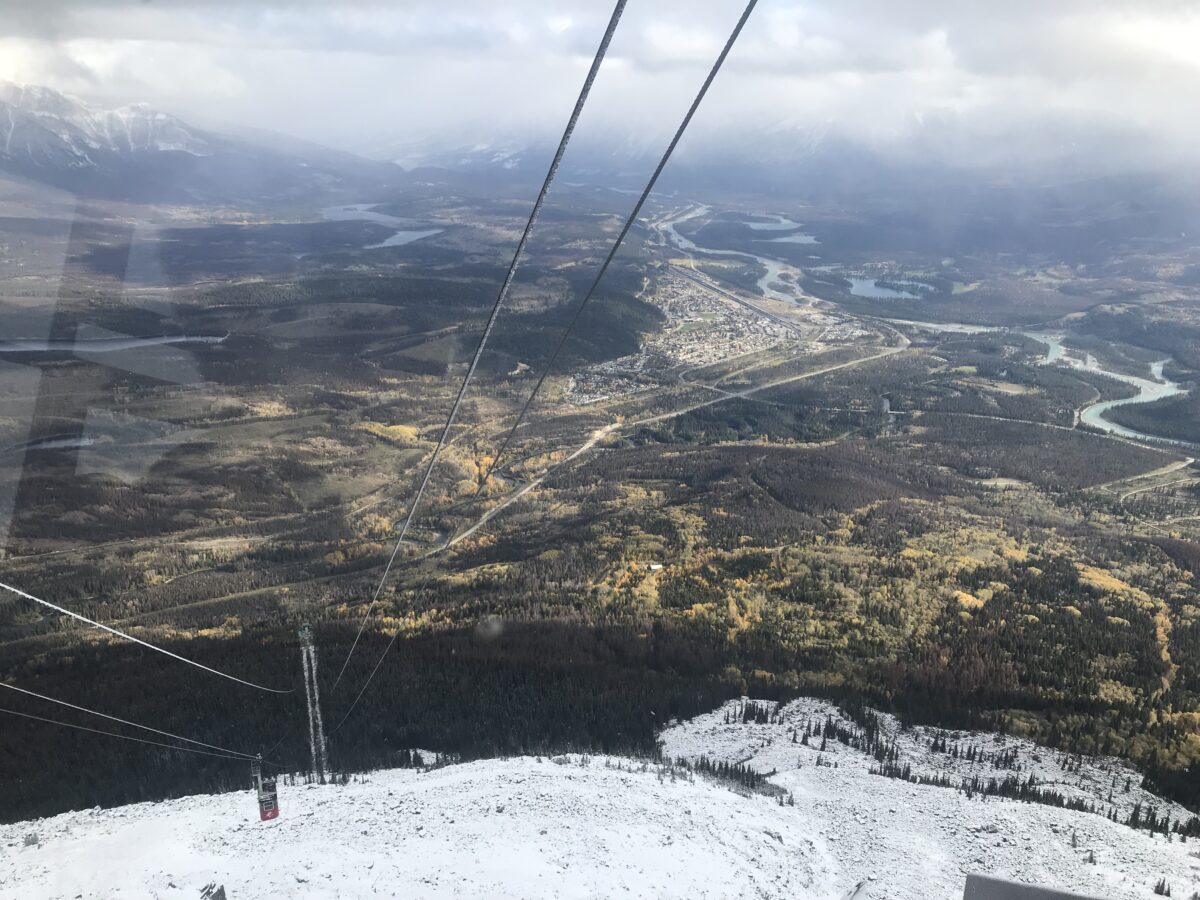 View from a cable car looking down a mountain suggesting fear.