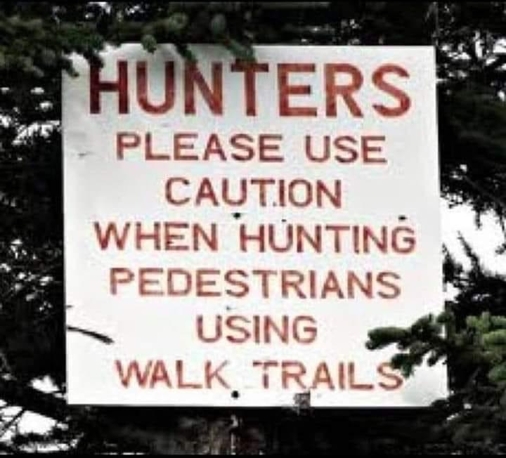 Sign says: Hunters Please Use Caution When Hunting Pedestrians Using Walk Trails, suggesting poor drafting skills