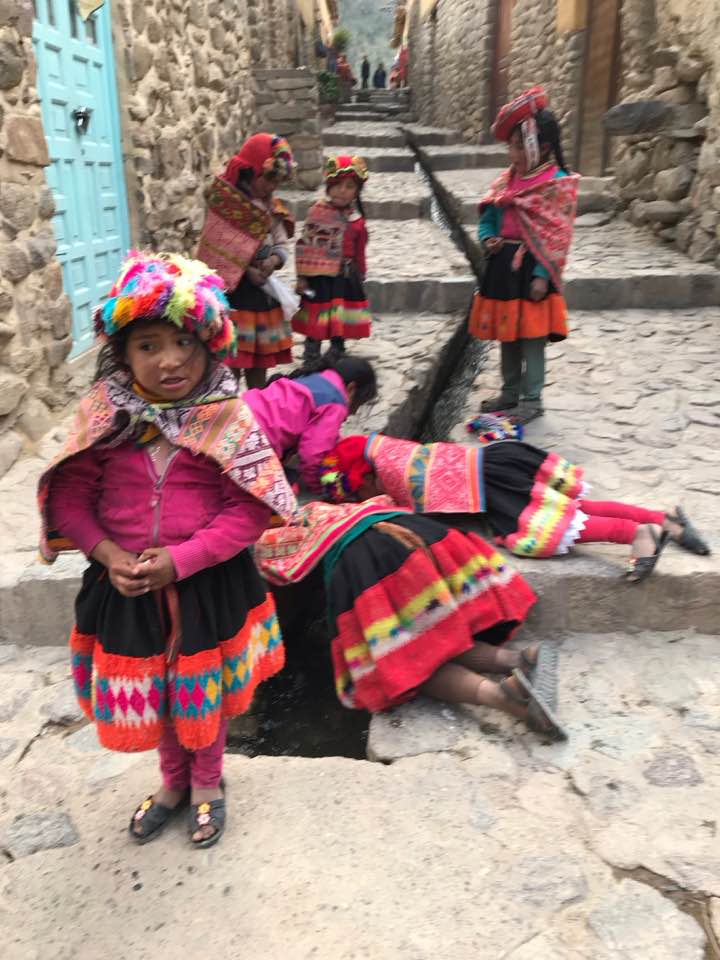 Young girls in traditional Peruvian costumes.