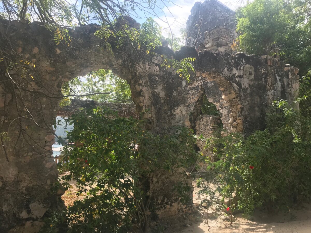 Ancient arches covered in vegetation suggesting that danger may lurk within.