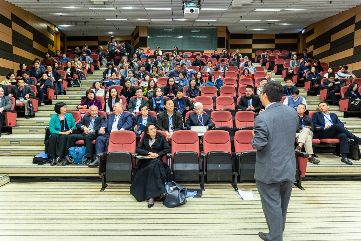 Speaker in front of audience.