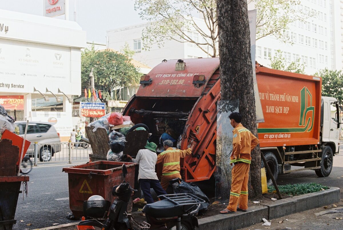 Garbage Truck being loaded.