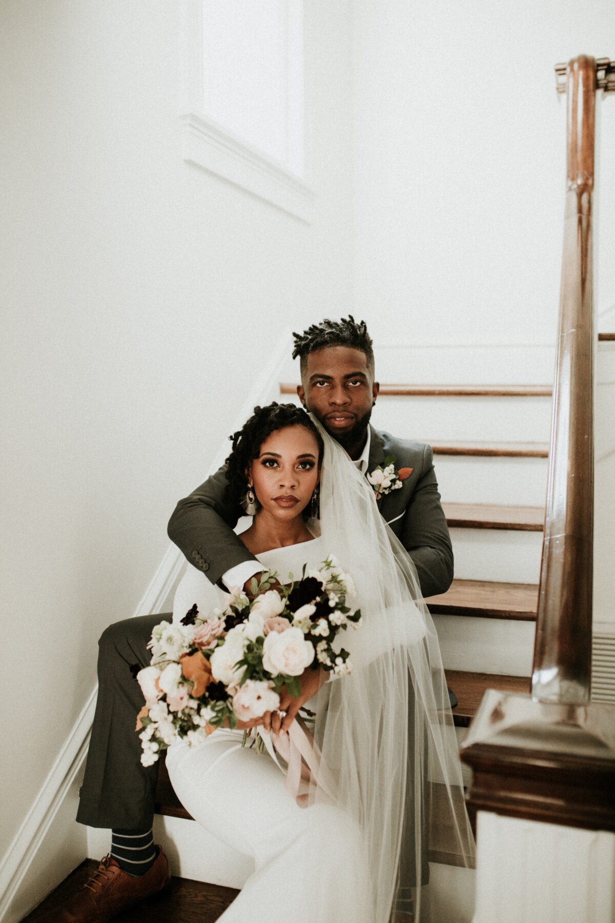 Bride and Groom sitting on stairs