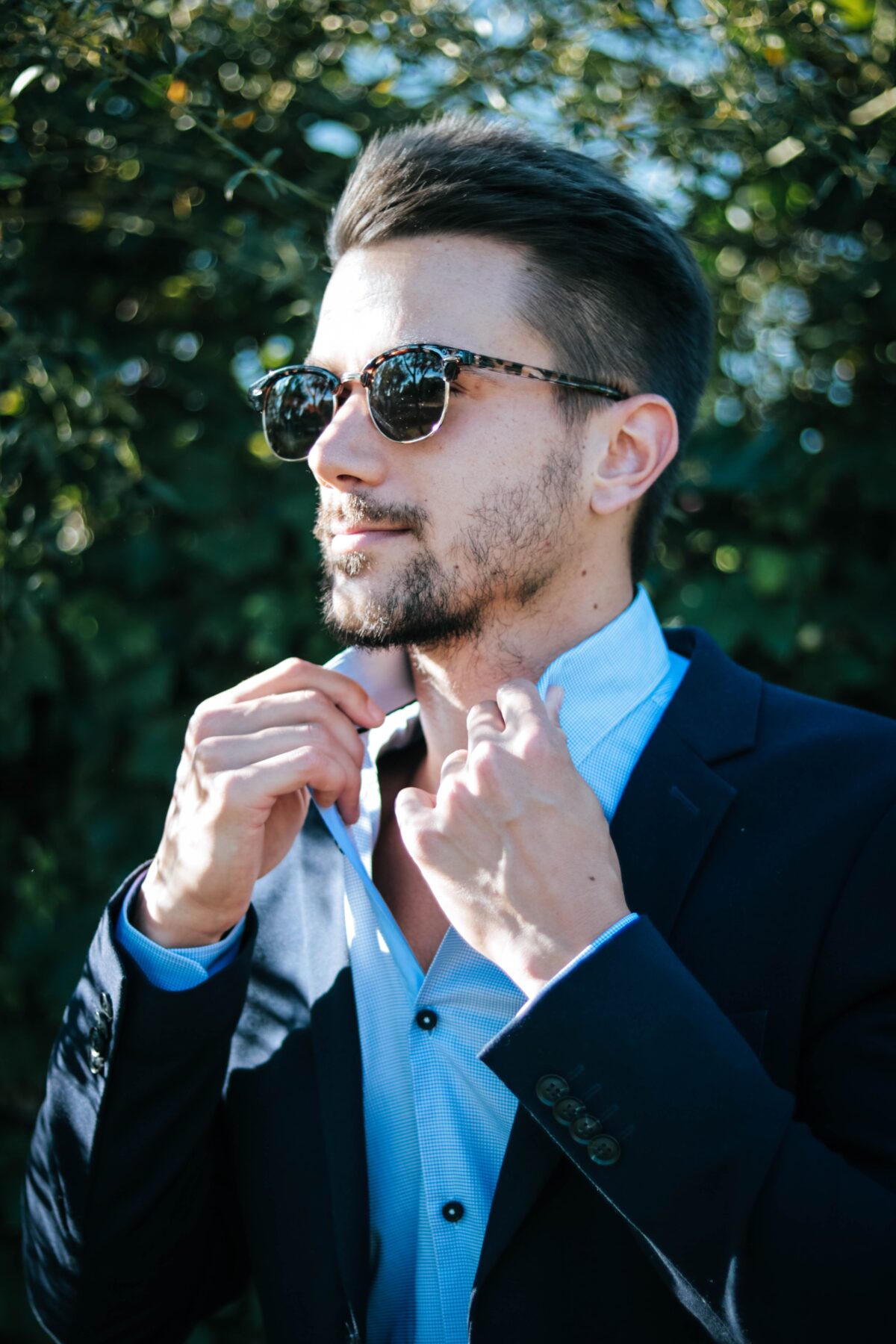 Confident looking man wearing sunglasses.