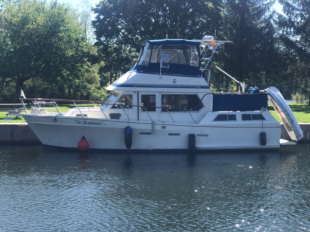 Boat named "On Business" docked.