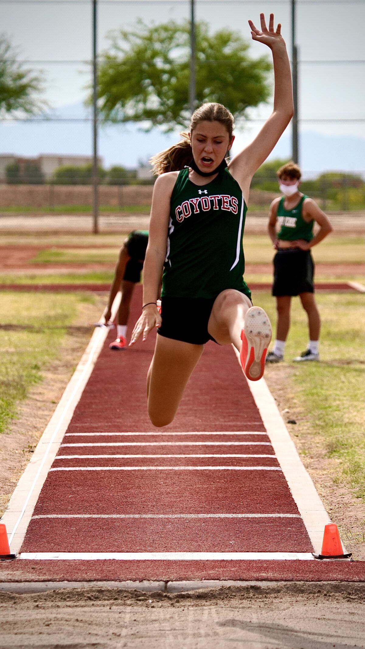 Female athlete doing the long jump.