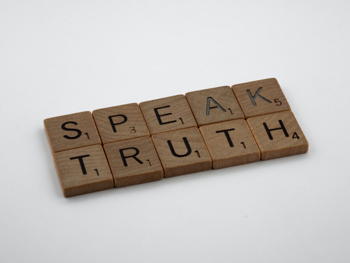 Scrabble pieces spelling the words "Speak Truth."