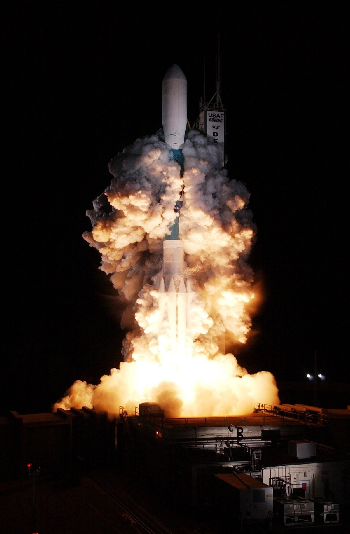 Rocket with space shuttle blasting off.
