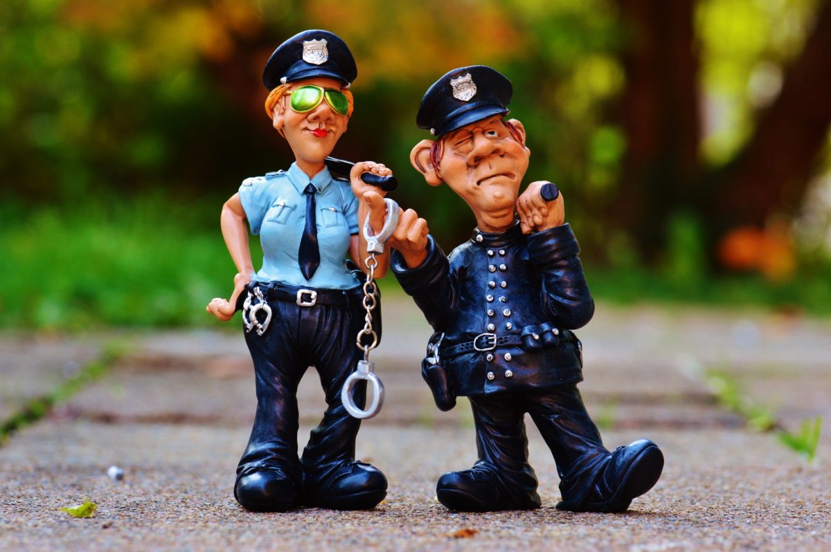 Two cartoonish police figurines.
