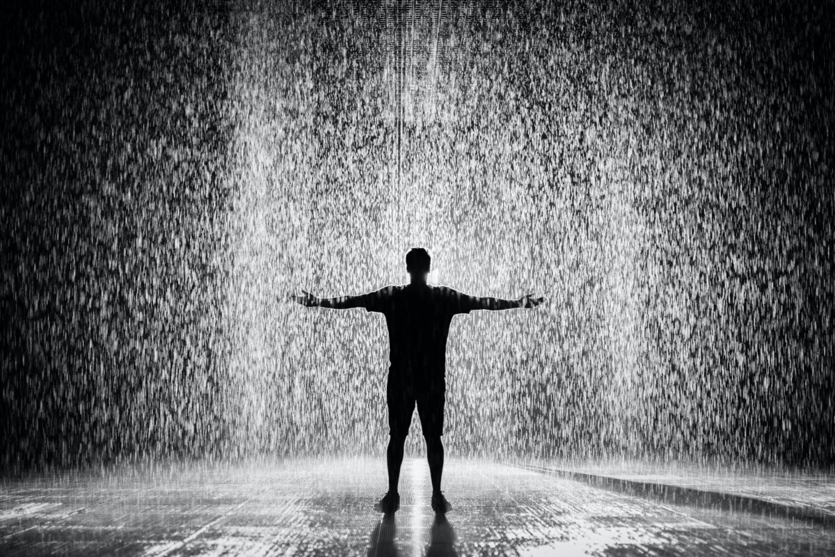 Man standing in the rain.