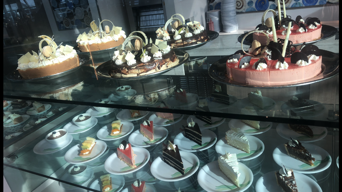 Cake and Pies on glass shelves.
