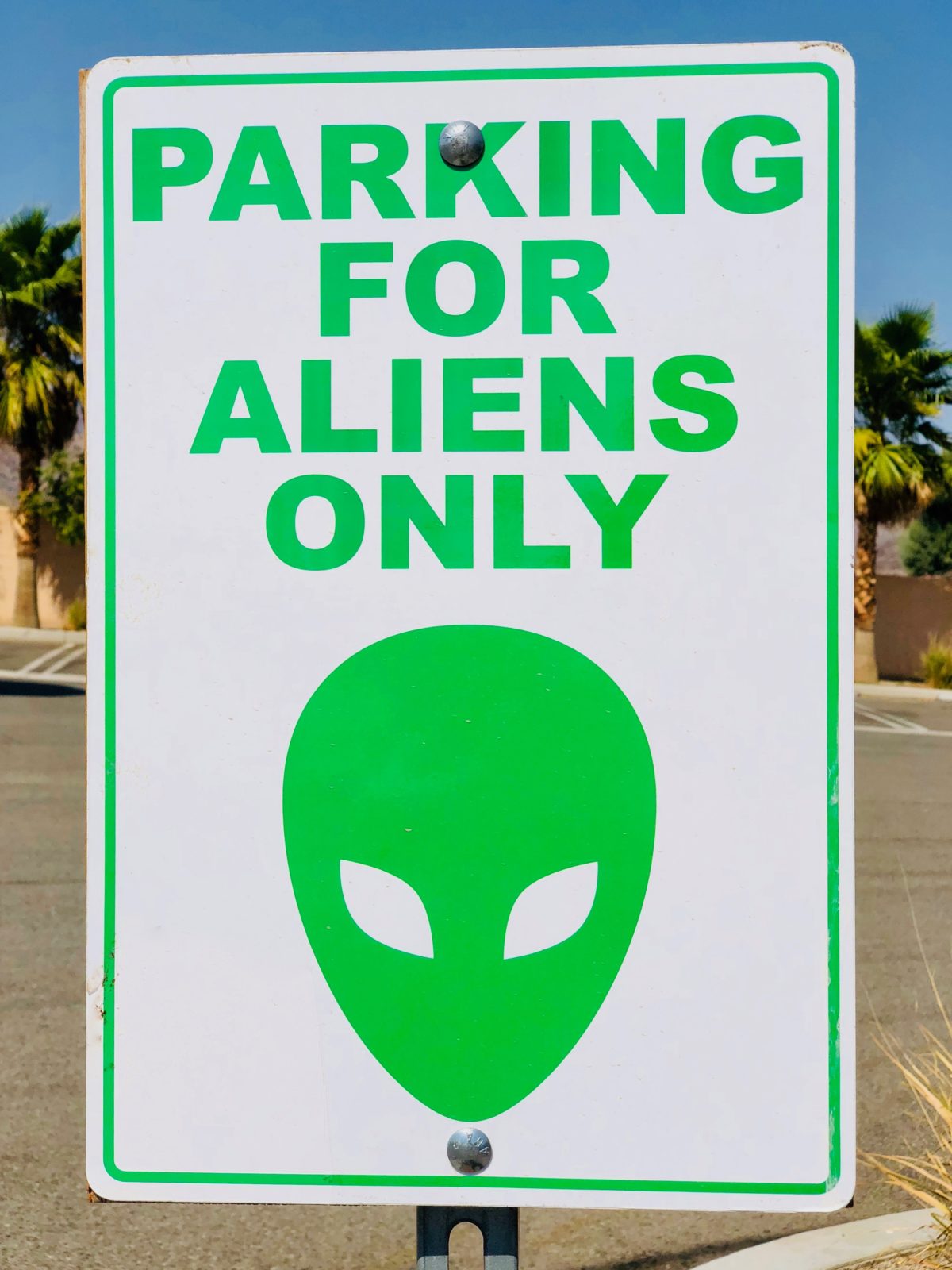 Sign that says "Parking for Aliens Only" with a picture of an Alien.
