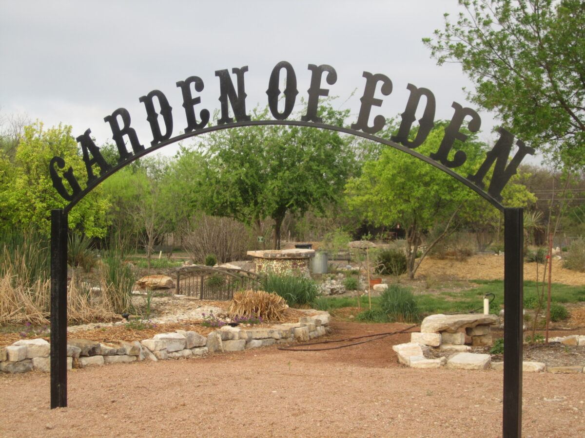Sign that says "Garden of Eden" with natural background - Garden of Eden in Eden Texas