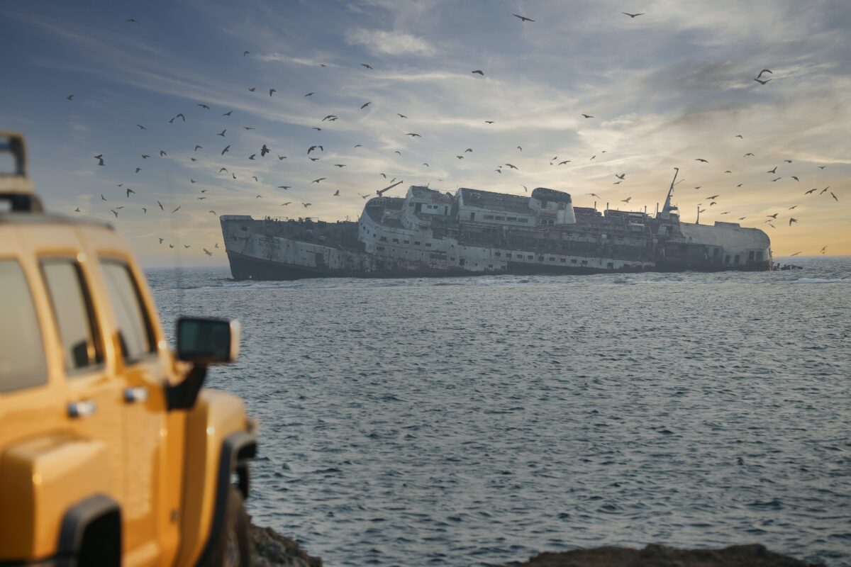 A large ship listing badly.