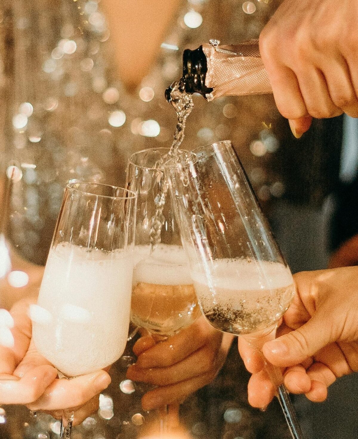 Champagne being poured into glasses.