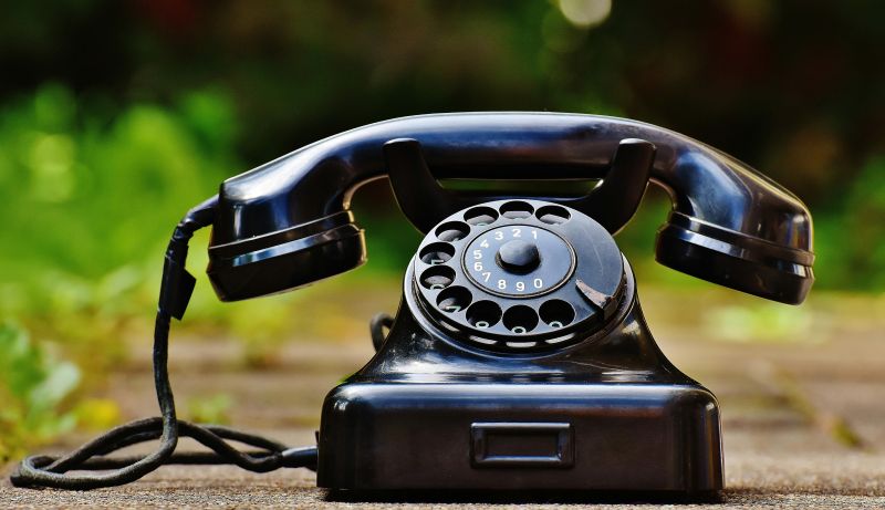 An old-fashioned rotary dial phone.