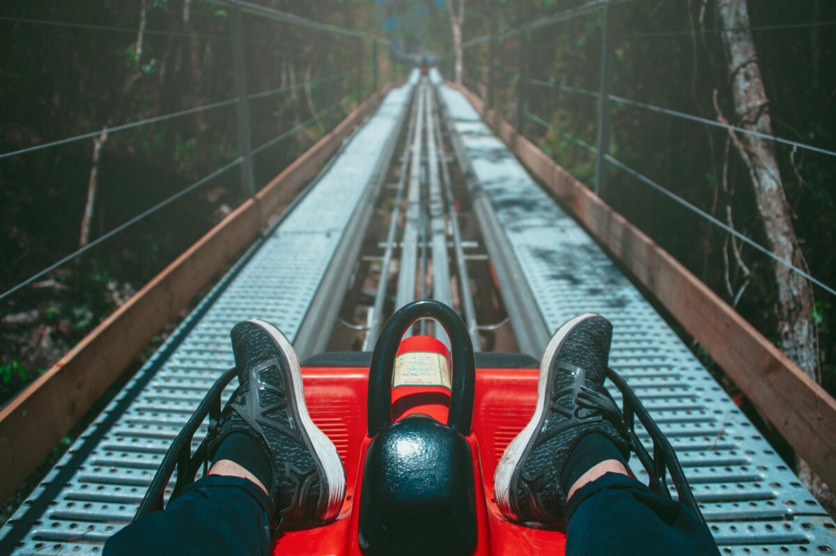 legs on a bobsled going downhill