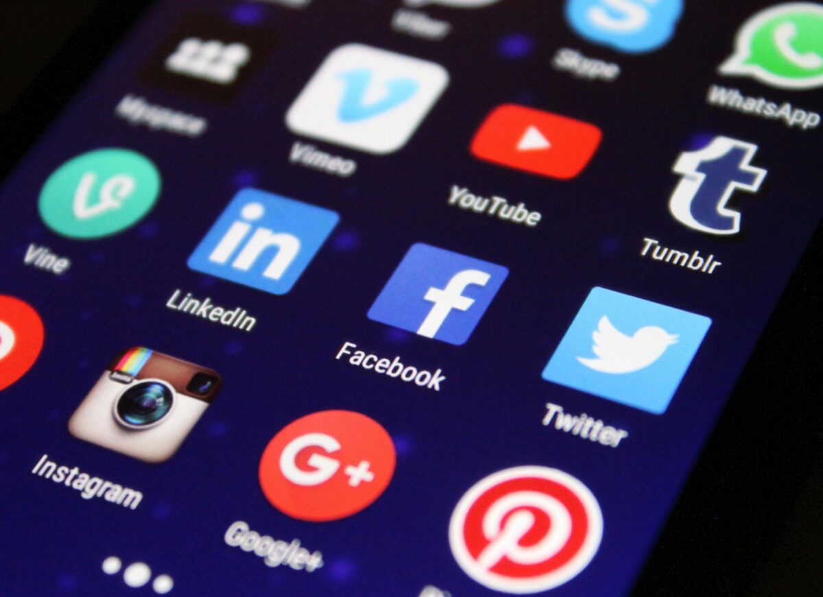 Phone screenw ith social media icons.