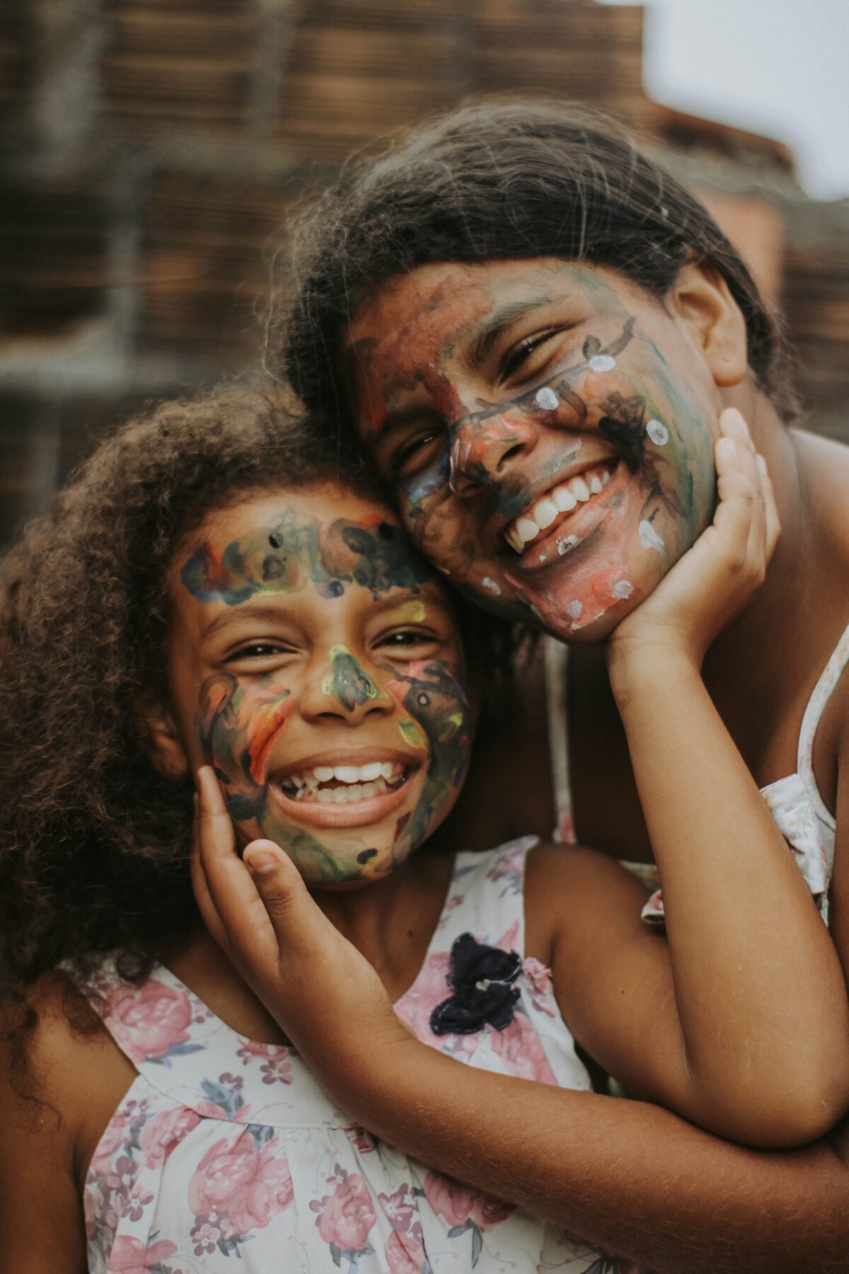 And adult and child with face paint.