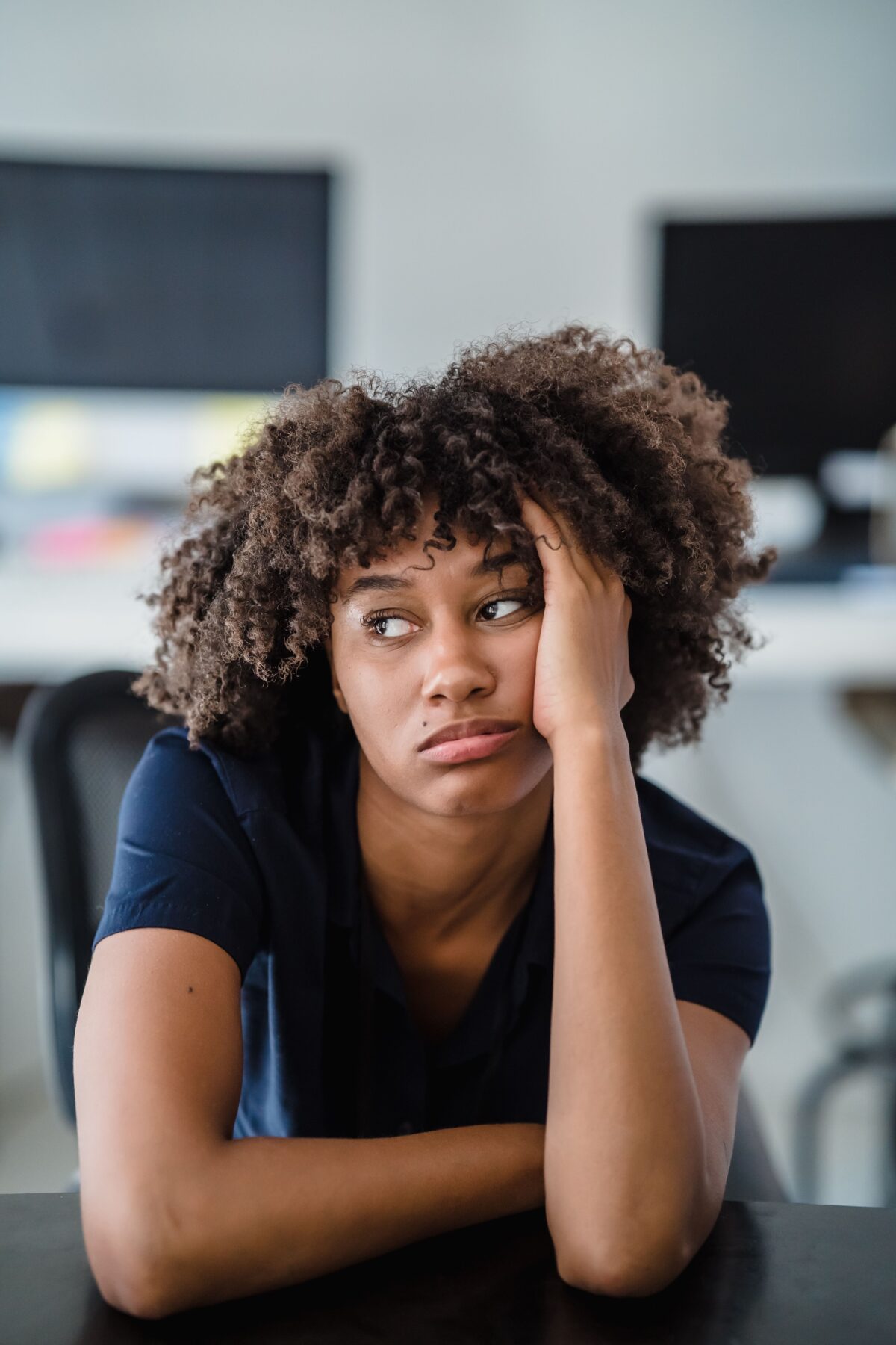 Woman looking bored.